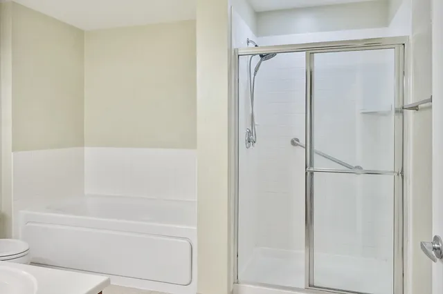 a bathroom with a bathtub and a shower