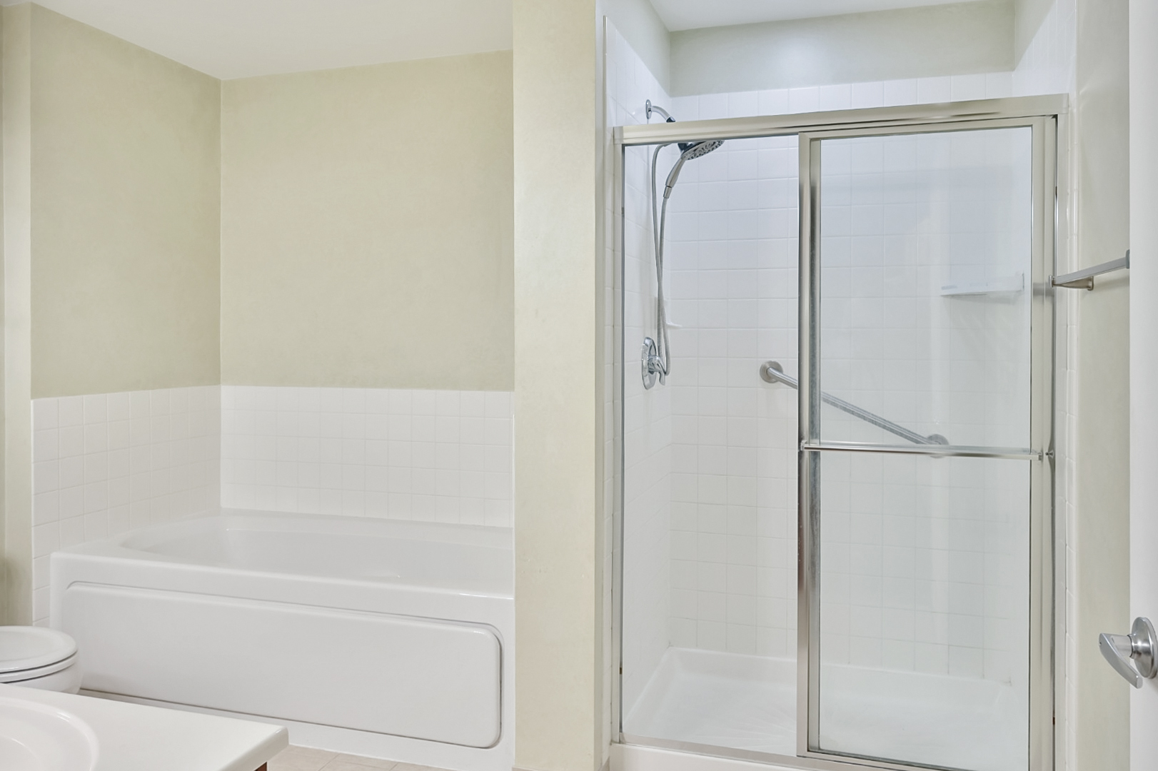 135 South York Street, Unit 314 Elmhurst, IL 60126 - Photo 8 of 24 a bathroom with a bathtub and a shower