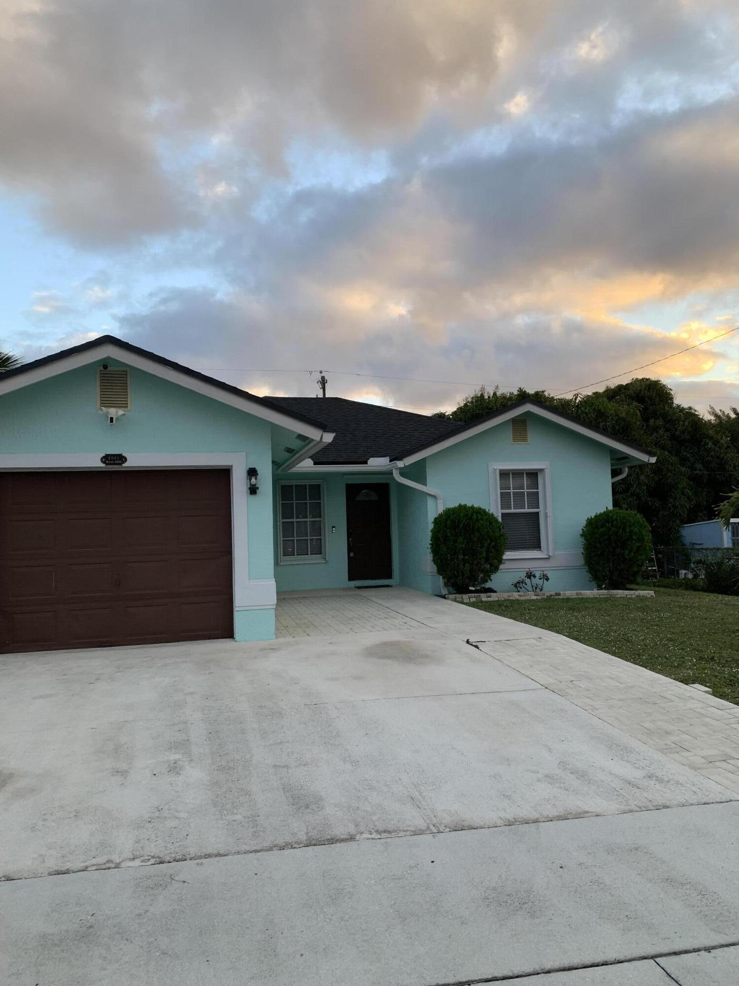1345 West 34th Street Riviera Beach, FL 33404 - Photo 1 of 19 Front of home2