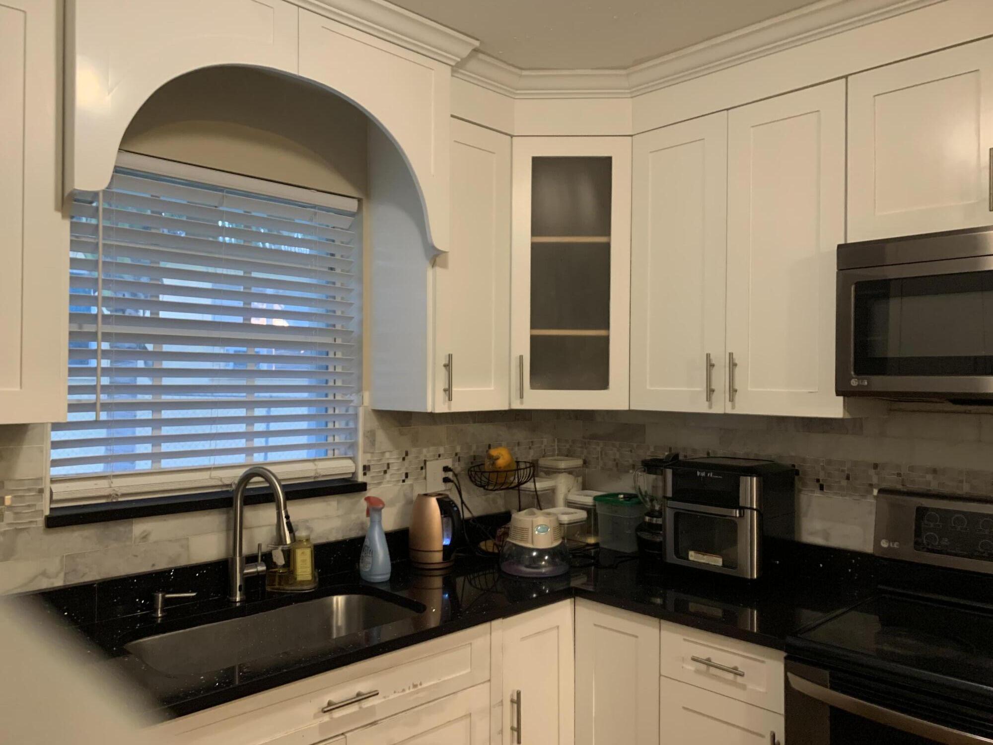 1345 West 34th Street Riviera Beach, FL 33404 - Photo 3 of 19 Kitchen - cupboard