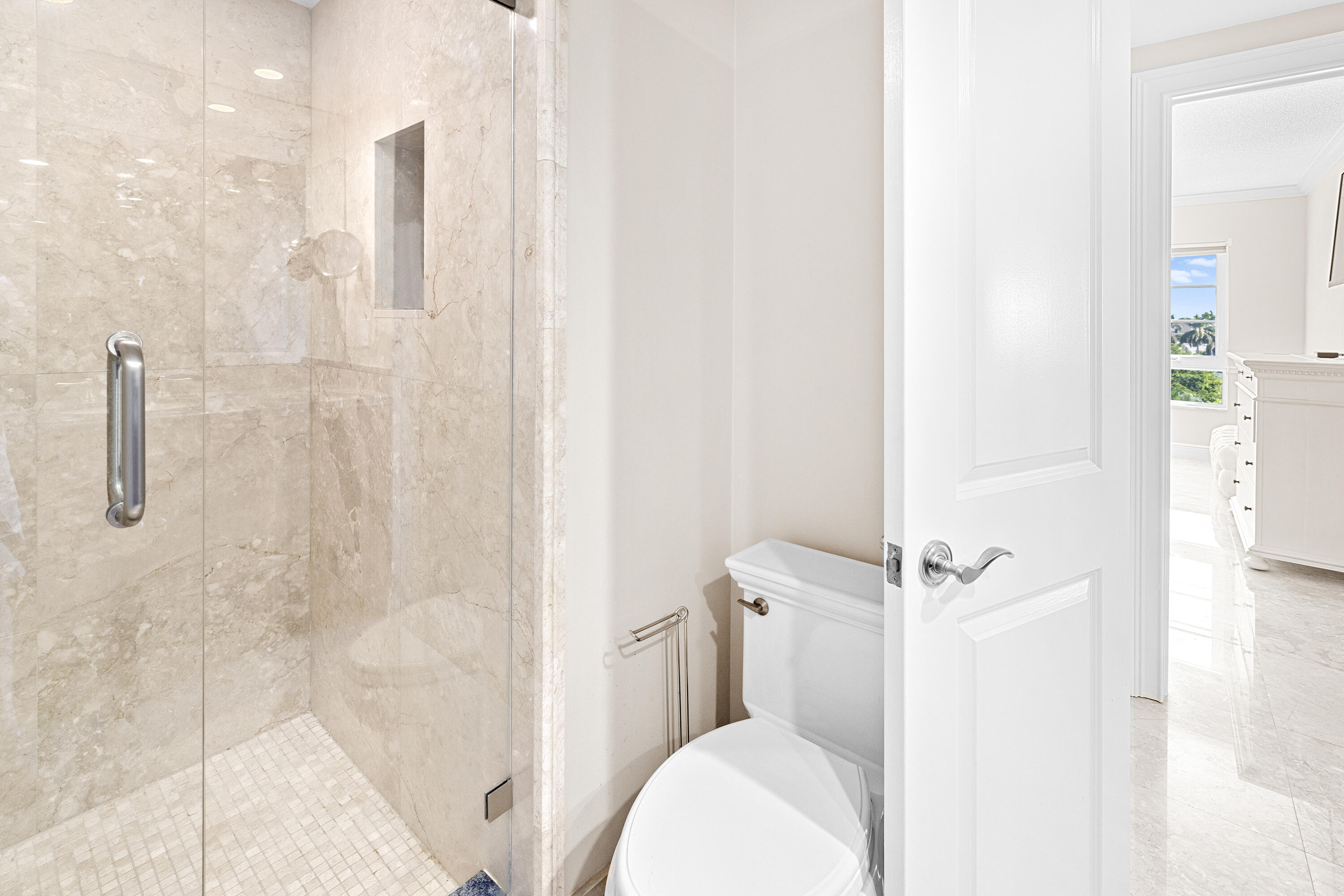 50 E Road, Unit 6E Delray Beach, FL 33483 - Photo 14 of 36 a bathroom with a shower and toilet