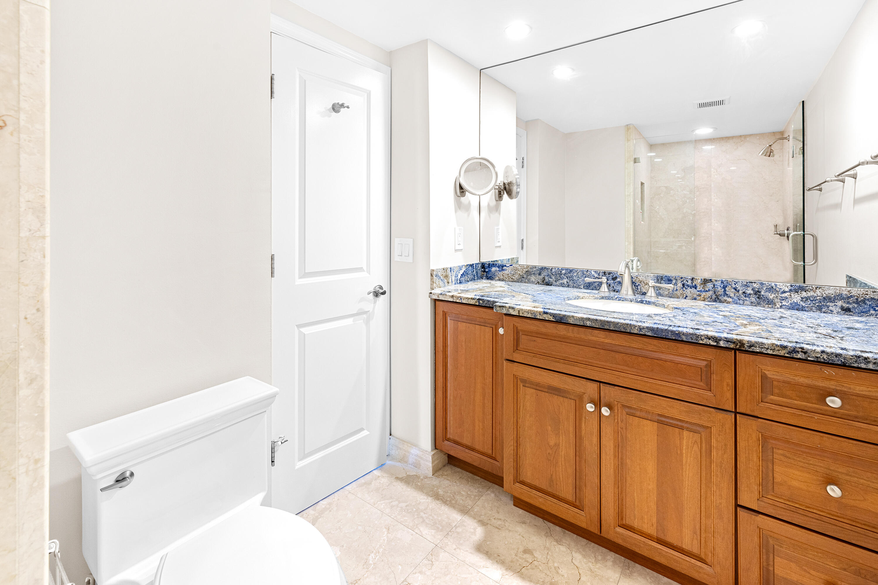 50 E Road, Unit 6E Delray Beach, FL 33483 - Photo 15 of 36 a bathroom with a sink a toilet and shower
