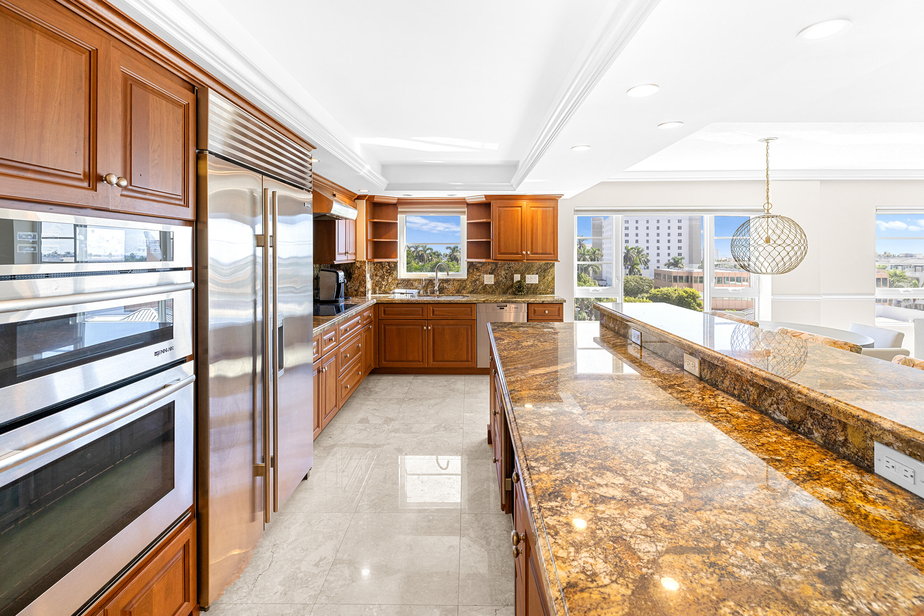 50 E Road, Unit 6E Delray Beach, FL 33483 - Photo 8 of 36 a large white kitchen with a large window and refrigerator