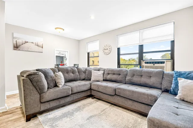 a living room with a couch and a window