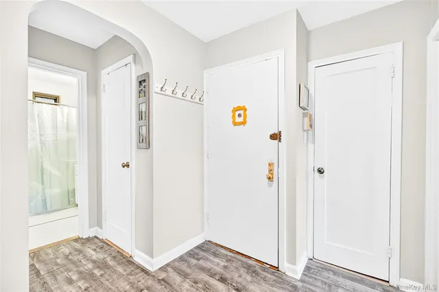 a view of bedroom with bathroom and window