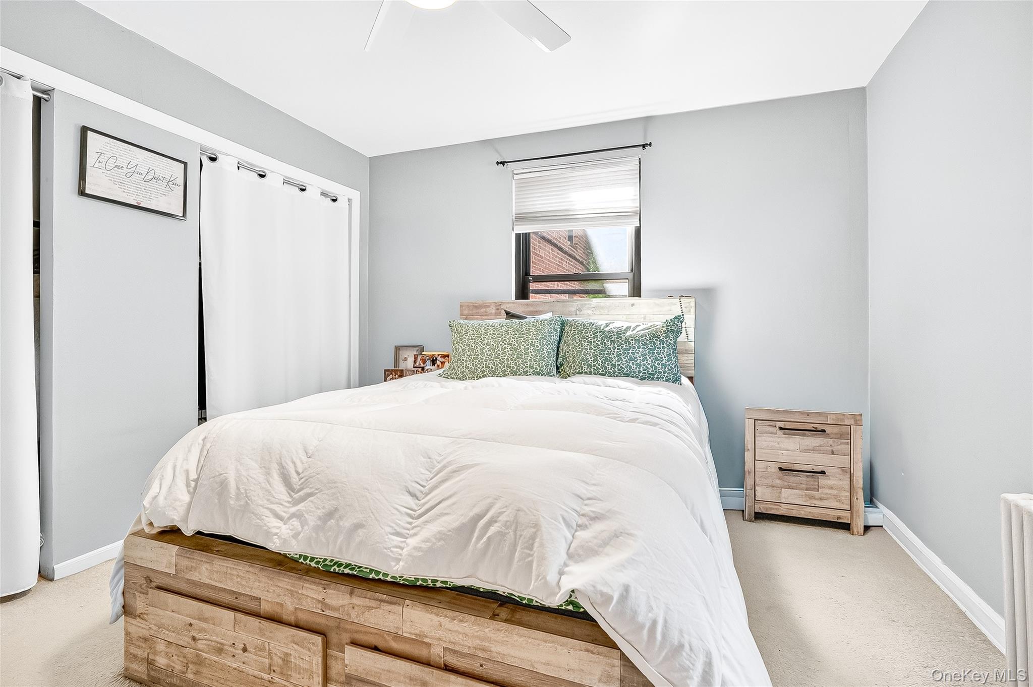 340 Richbell Road, Unit B4 Mamaroneck, NY 10543 - Photo 16 of 24 a bedroom with a bed and a mirror