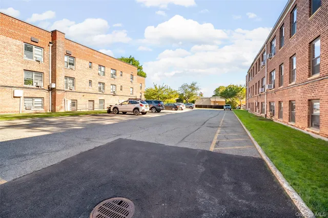 a view of a street with a building in the background