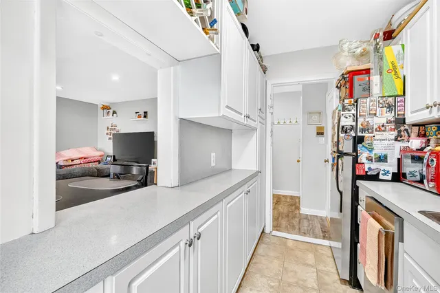 a hallway with sliding door and wooden floor