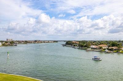 9425 Blind Pass Road, Unit 408 St. Pete Beach, FL 33706 - Photo 26 of 57 a view of a lake and city