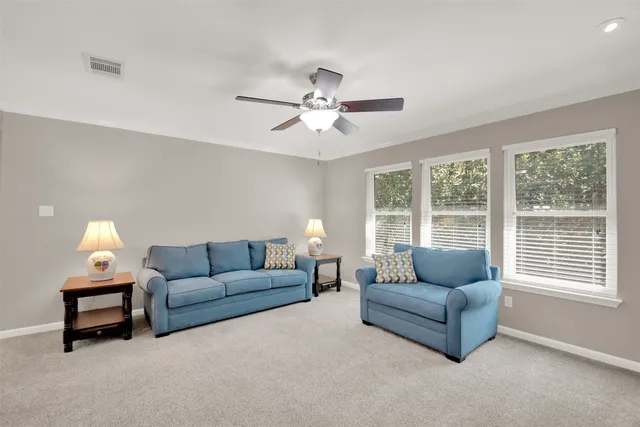 a living room with furniture and a window