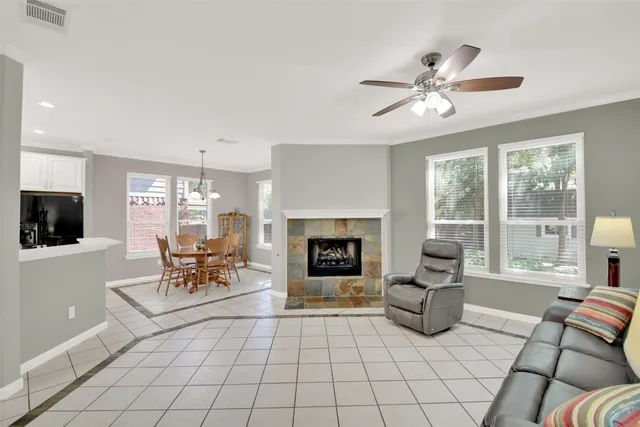 a living room with furniture and a fireplace