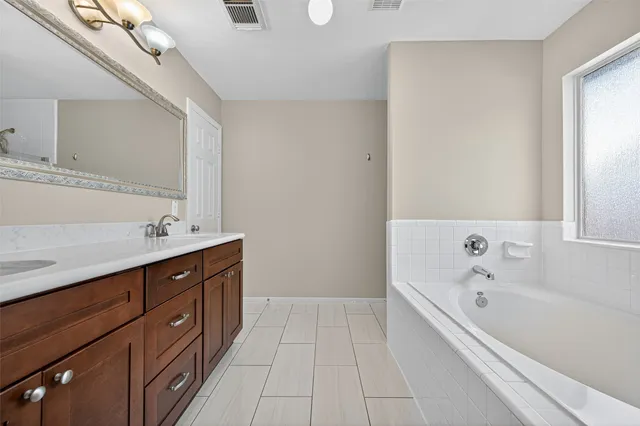a bathroom with a sink a vanity and a mirror