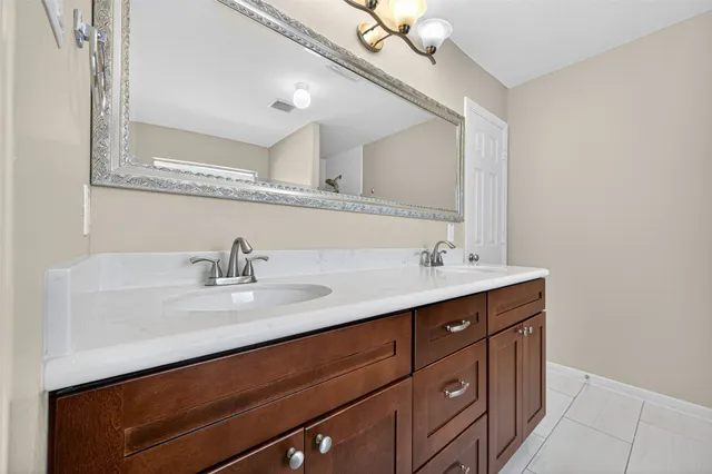 a white bath tub sitting next to a white sink