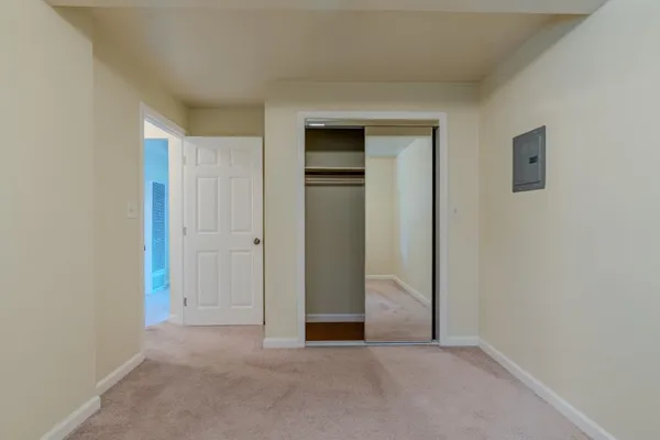 a view of an empty room and closet