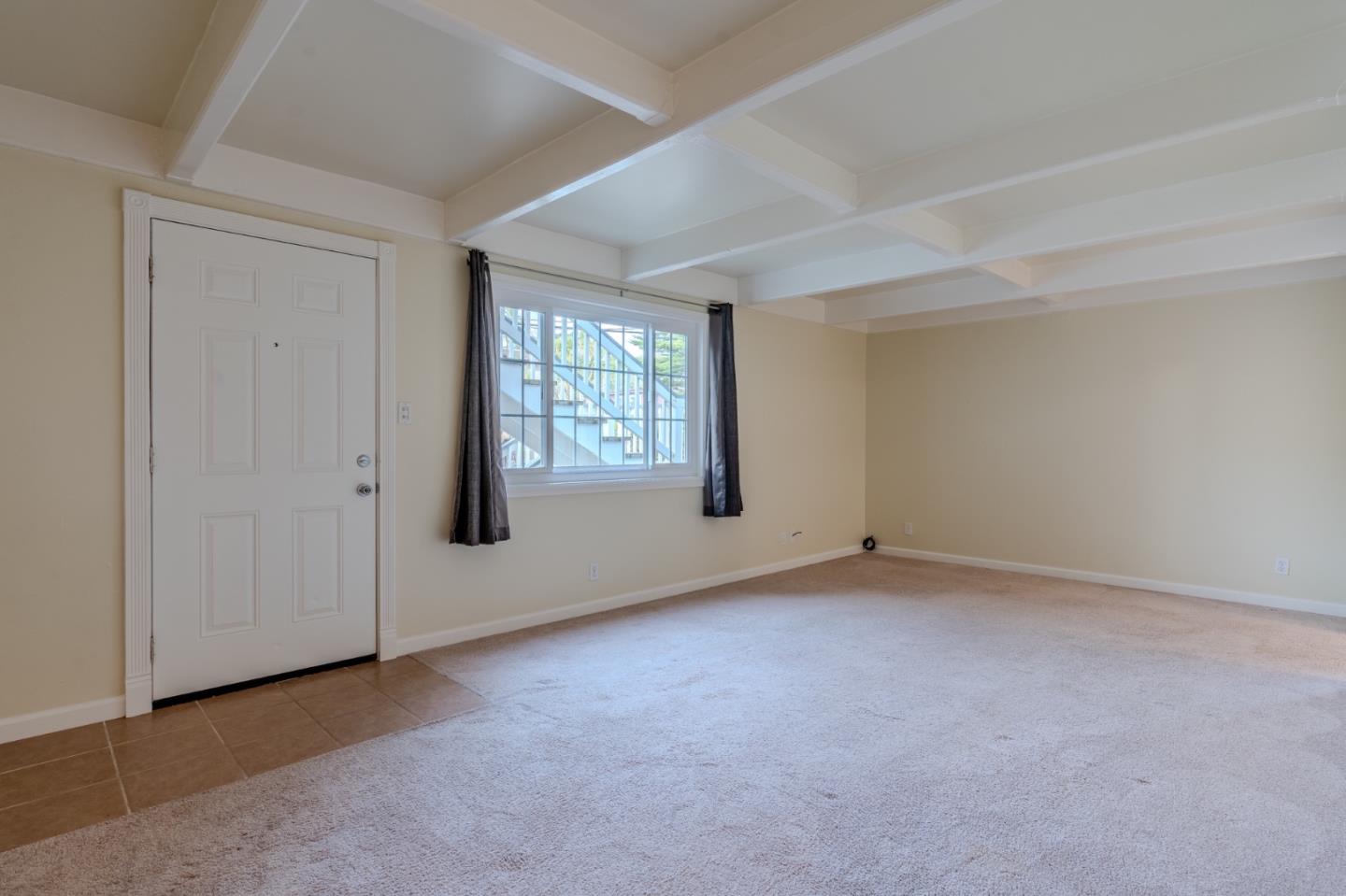102 Brighton Road, Unit 1 Pacifica, CA 94044 - Photo 3 of 13 an empty room with windows
