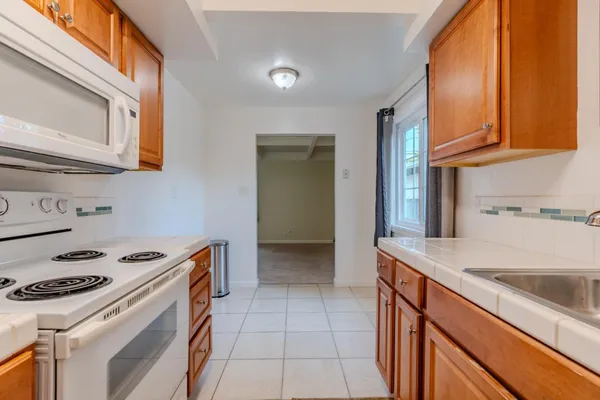 a kitchen with a stove and a sink