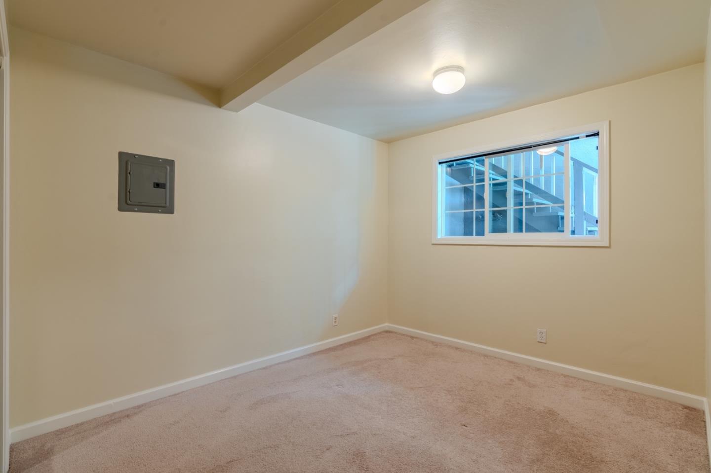 102 Brighton Road, Unit 1 Pacifica, CA 94044 - Photo 10 of 13 an empty room with windows