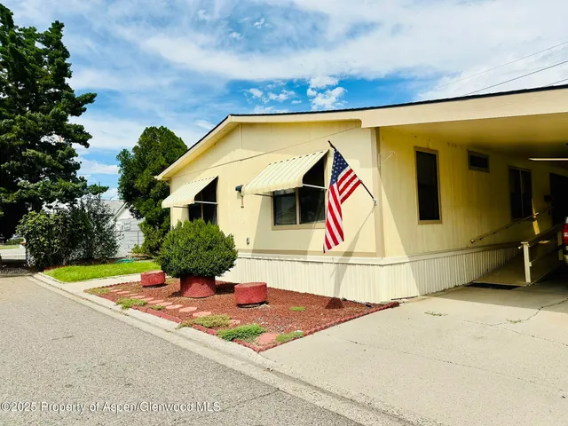 a front view of a house with a garage