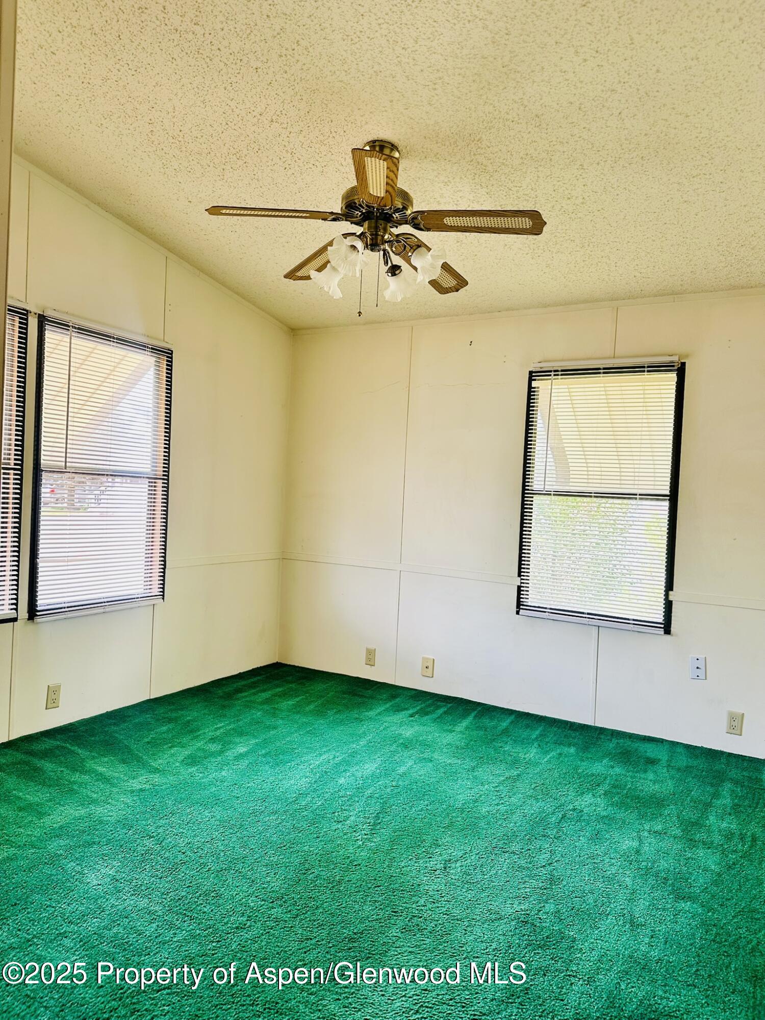 3195 F Road, Unit 1 Grand Junction, CO 81504 - Photo 12 of 22 a view of room with window and ceiling fan