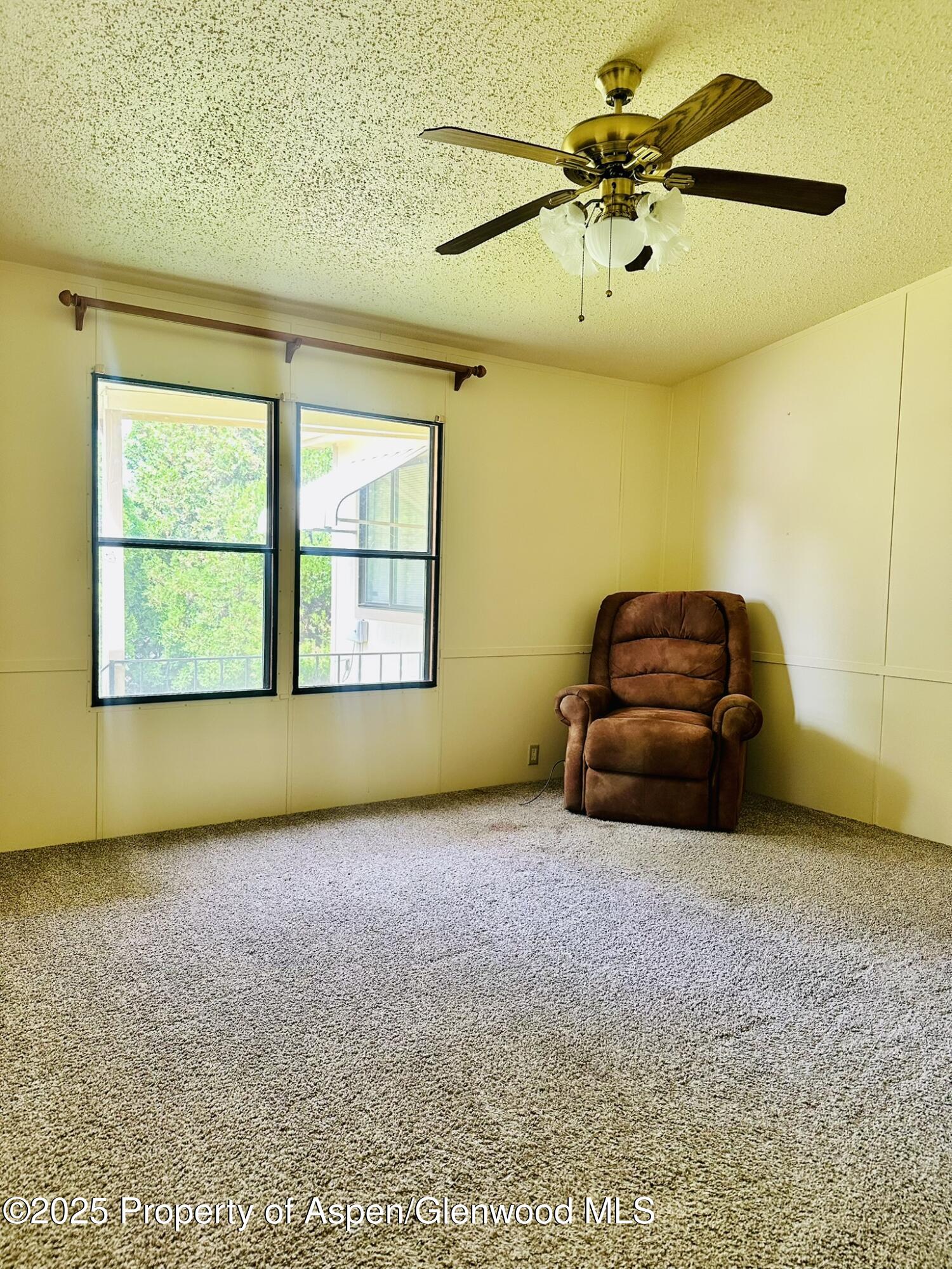 3195 F Road, Unit 1 Grand Junction, CO 81504 - Photo 13 of 22 a living room with a couch