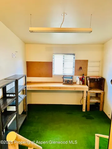 a view of a porch with wooden floor and fence
