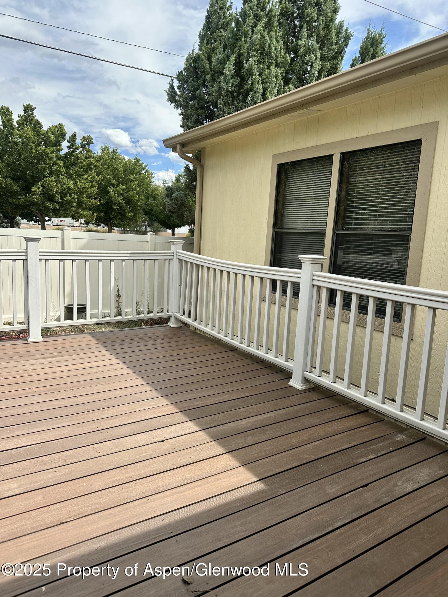 3195 F Road, Unit 1 Grand Junction, CO 81504 - Photo 19 of 22 a view of deck with wooden floor and fence
