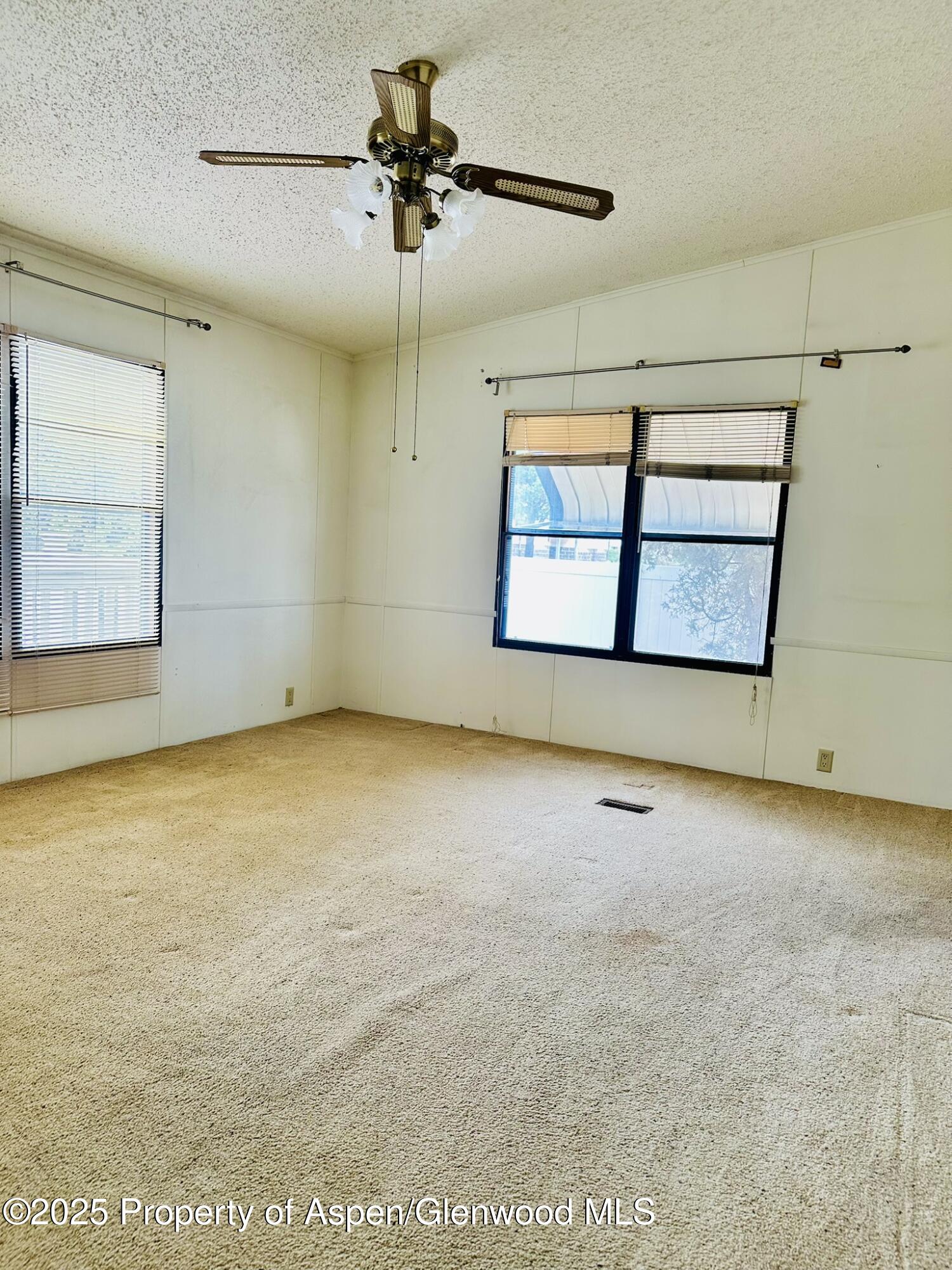 3195 F Road, Unit 1 Grand Junction, CO 81504 - Photo 9 of 22 a view of an empty room with a window