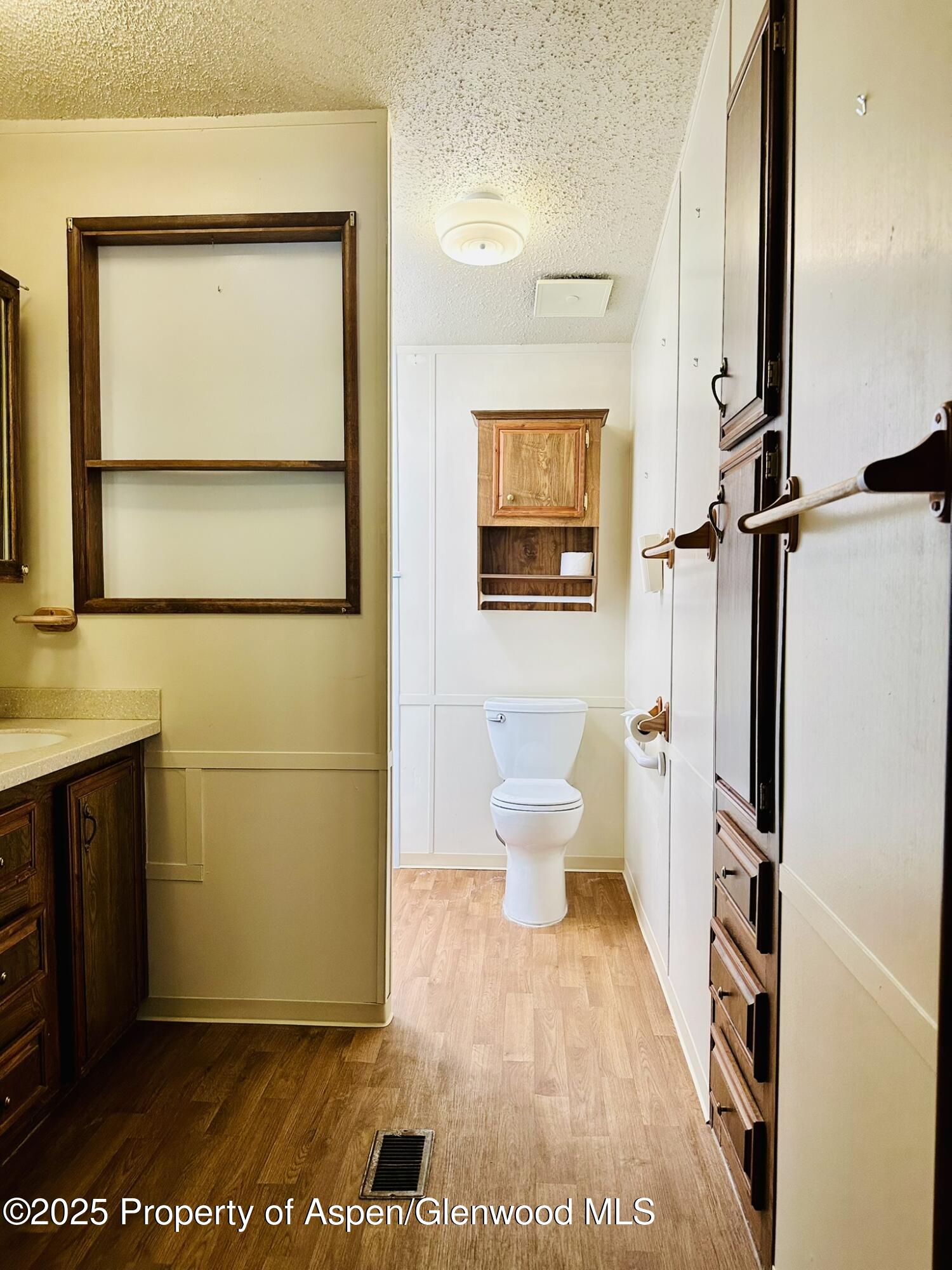 3195 F Road, Unit 1 Grand Junction, CO 81504 - Photo 10 of 22 a bathroom with a toilet sink and mirror