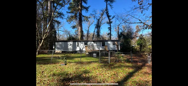 a view of swimming pool with a yard