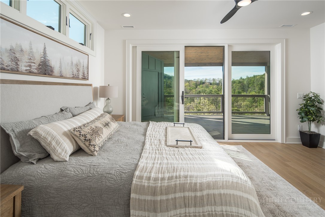 359 Calico Court Boone, NC 28607 - Photo 29 of 50 a bedroom with a large bed and a large window
