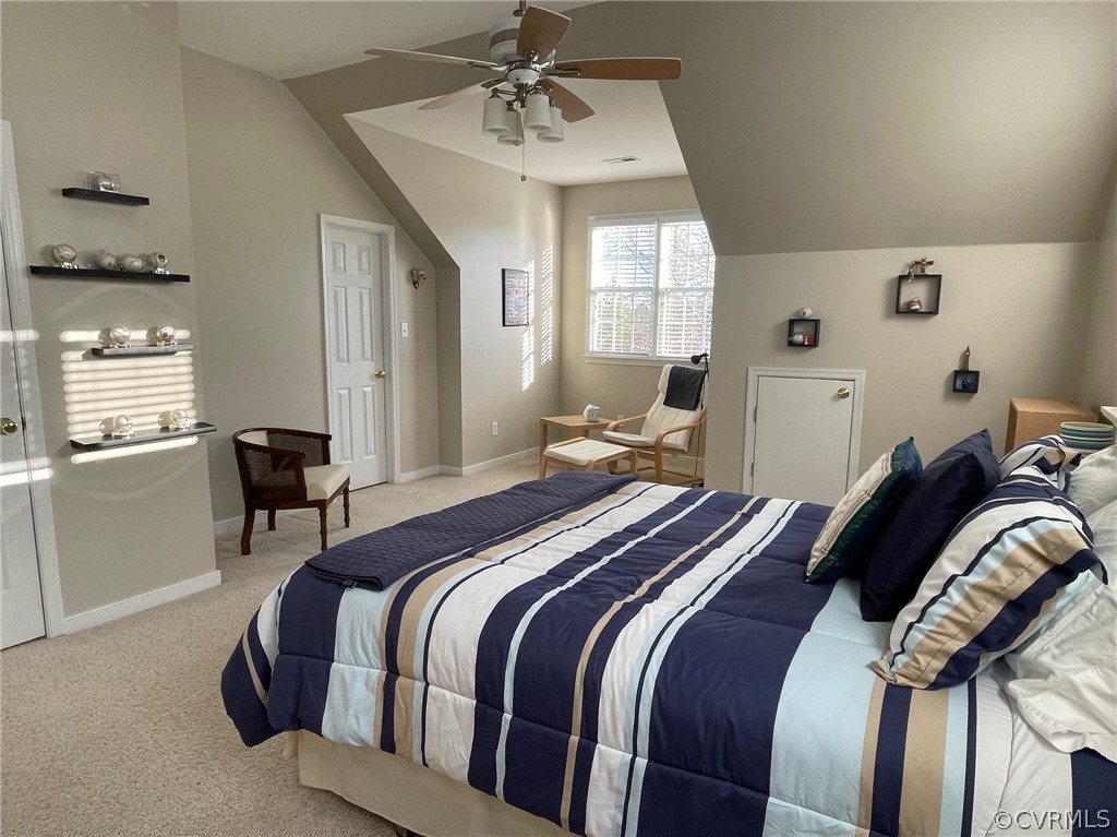 1124 Goswick Ridge Road Midlothian, VA 23114 - Photo 8 of 10 a bedroom with a bed and a chandelier