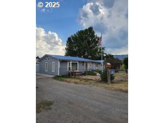 650 East Chestnut Street Union, OR 97883 - Photo 2 of 21 a view of a house with a yard and sitting area