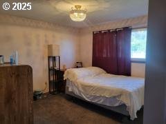 650 East Chestnut Street Union, OR 97883 - Photo 7 of 21 a bedroom with a bed and a table in it