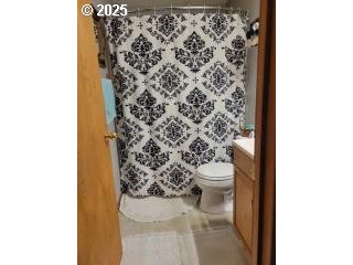 650 East Chestnut Street Union, OR 97883 - Photo 10 of 21 a bathroom with a toilet and a shower curtain