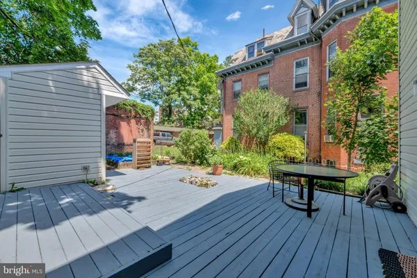 a view of a backyard with sitting area