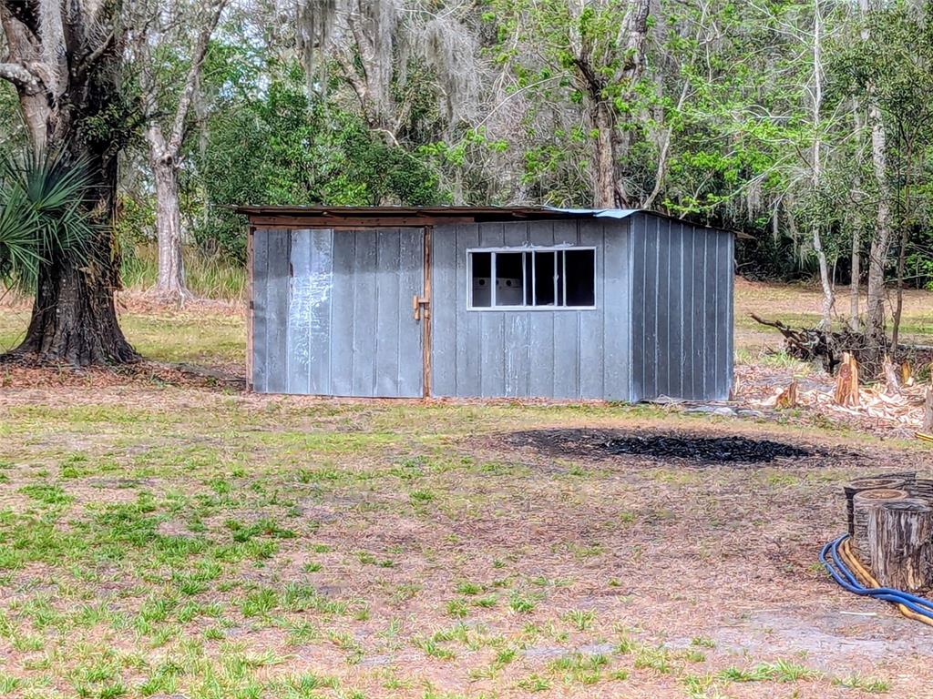 1142 Doc Coil Road Bowling Green, FL 33834 - Photo 25 of 27 front view of a house with a yard