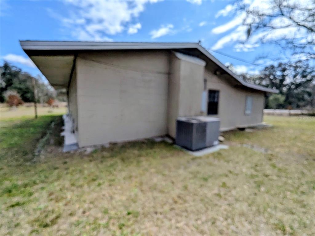 1142 Doc Coil Road Bowling Green, FL 33834 - Photo 3 of 27 a house with a yard