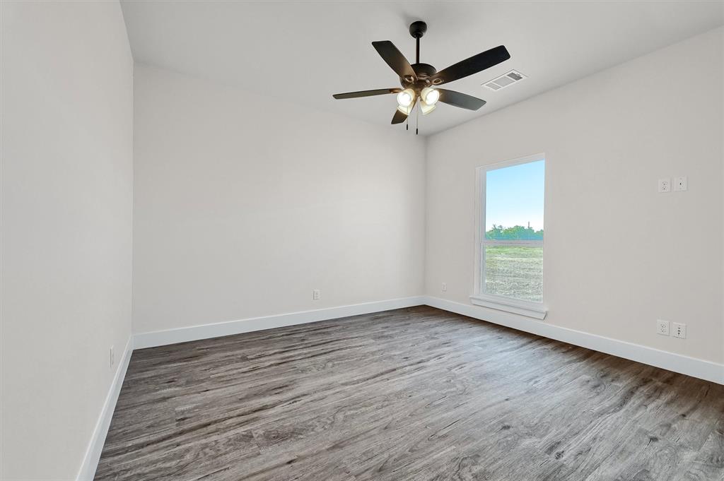 436 Dixie Road Whitesboro, TX 76273 - Photo 26 of 33 wooden floor in an empty room