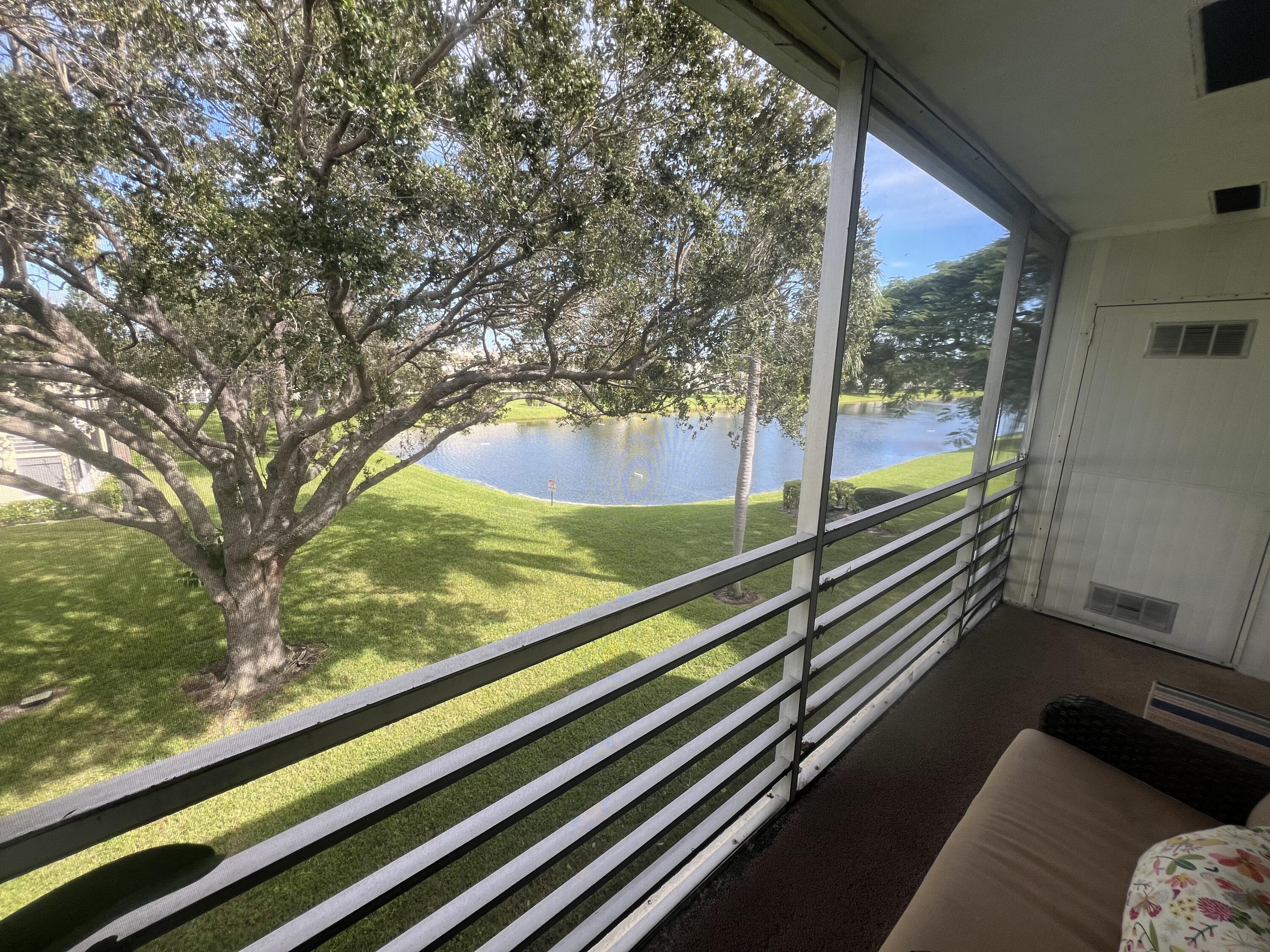 79 Dorset B Boca Raton, FL 33434 - Photo 12 of 12 a view of a balcony and floor to ceiling windows