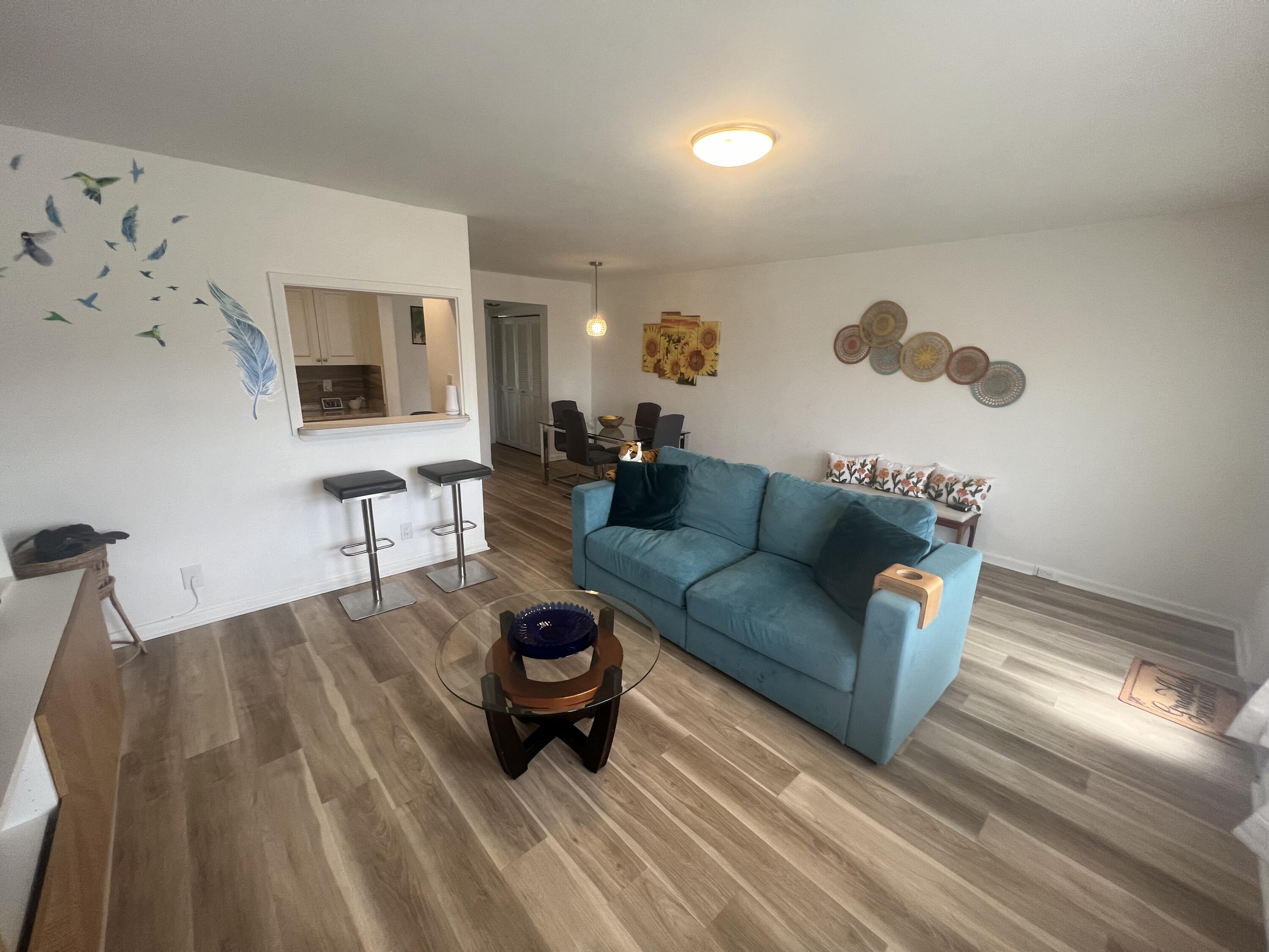 79 Dorset B Boca Raton, FL 33434 - Photo 2 of 12 a living room with furniture and a flat screen tv