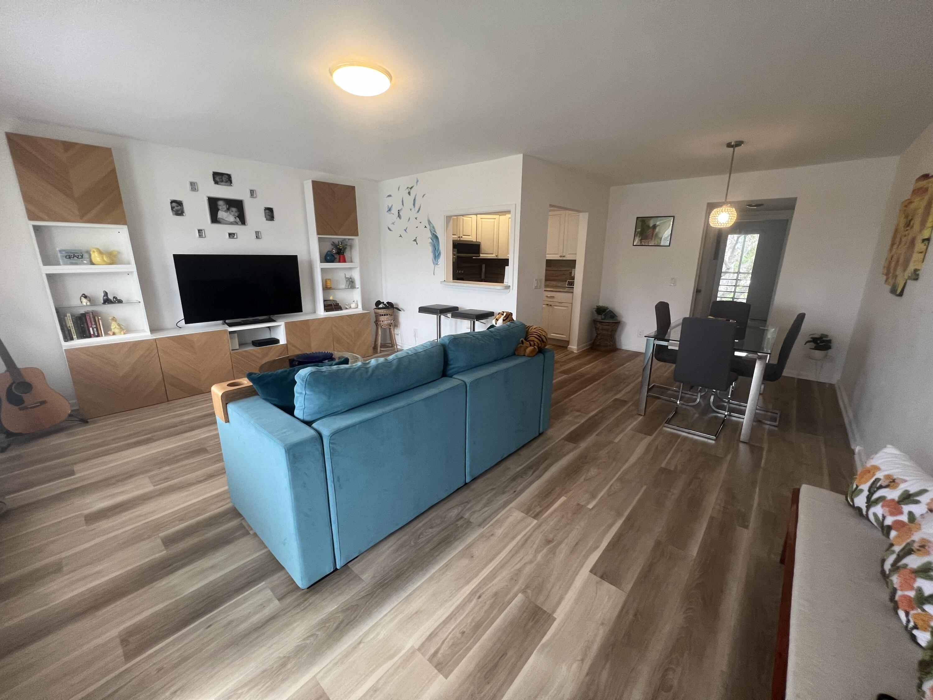 79 Dorset B Boca Raton, FL 33434 - Photo 3 of 12 a living room with furniture and a wooden floor