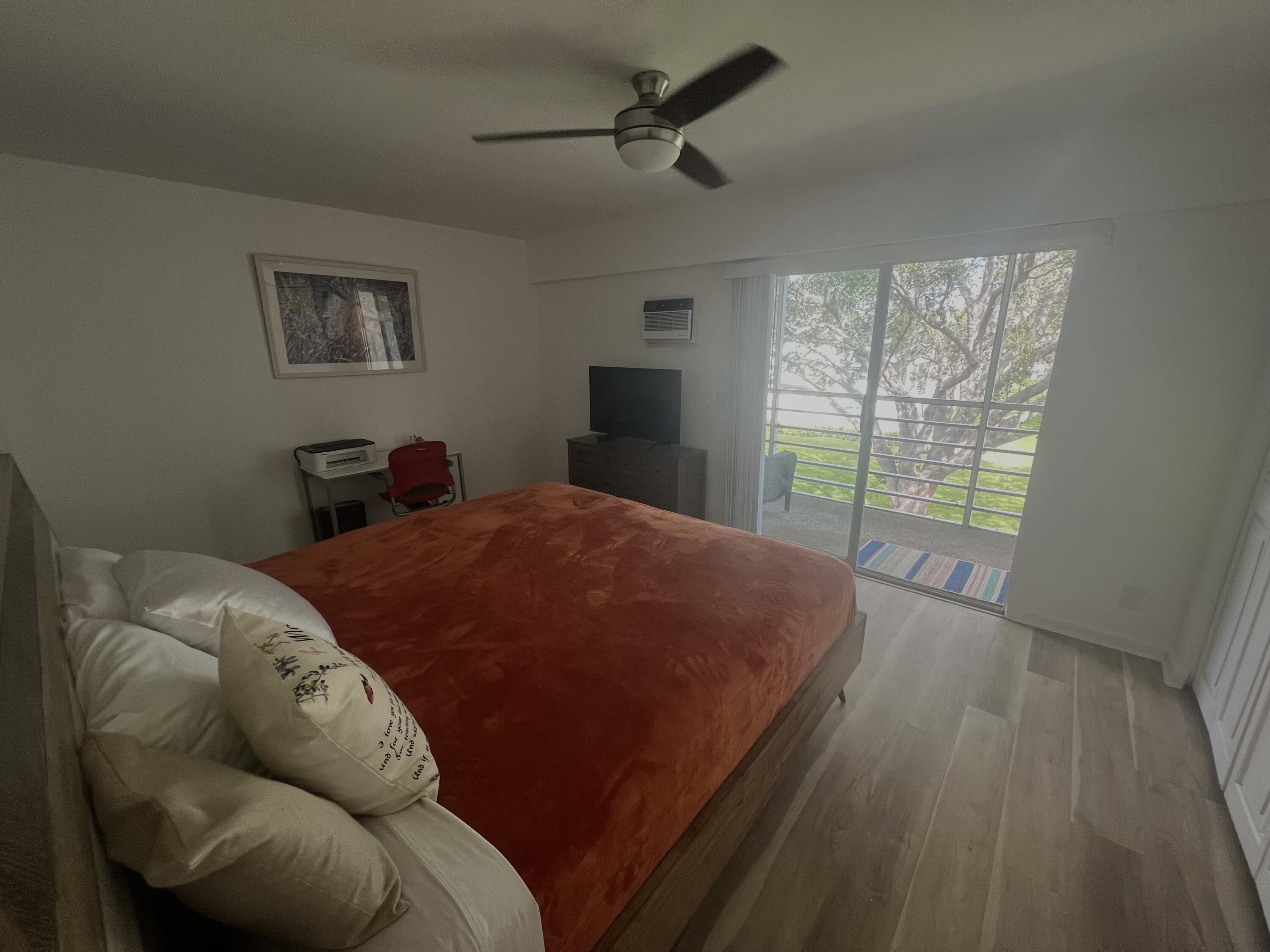 79 Dorset B Boca Raton, FL 33434 - Photo 10 of 12 a bed sitting in a bedroom next to a window