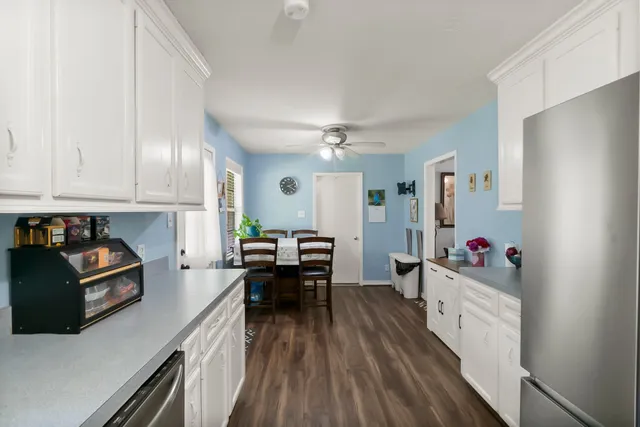 a bathroom with a sink and mirror with toilet