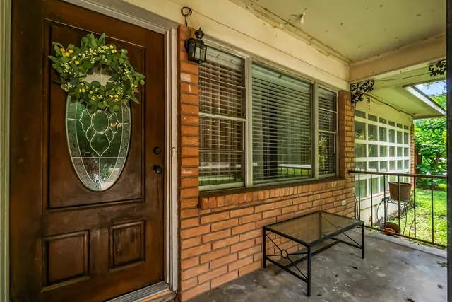 a living room with furniture ceiling fan and a flat screen tv