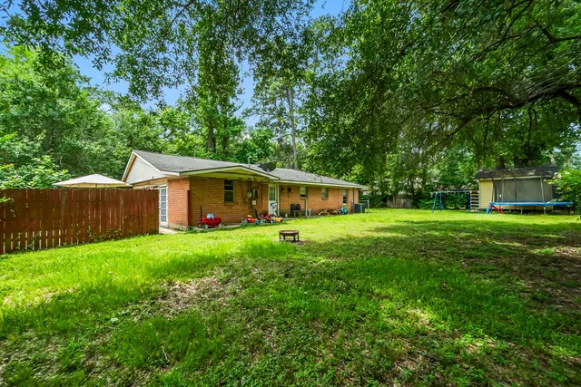 a view of outdoor space with deck and yard