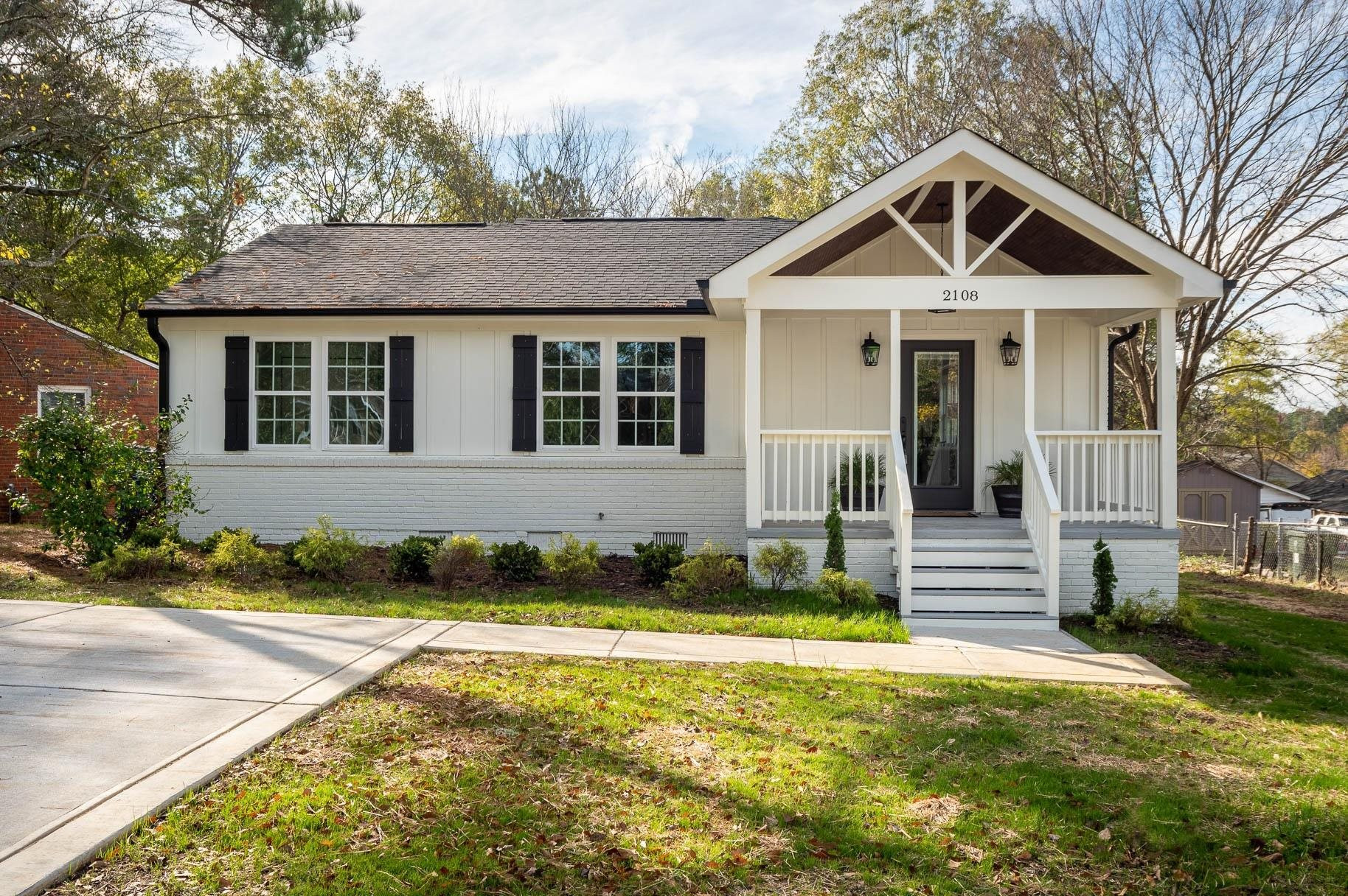 2108 Ramseur Street Raleigh, NC 27610 - Photo 1 of 26 a front view of a house with a yard