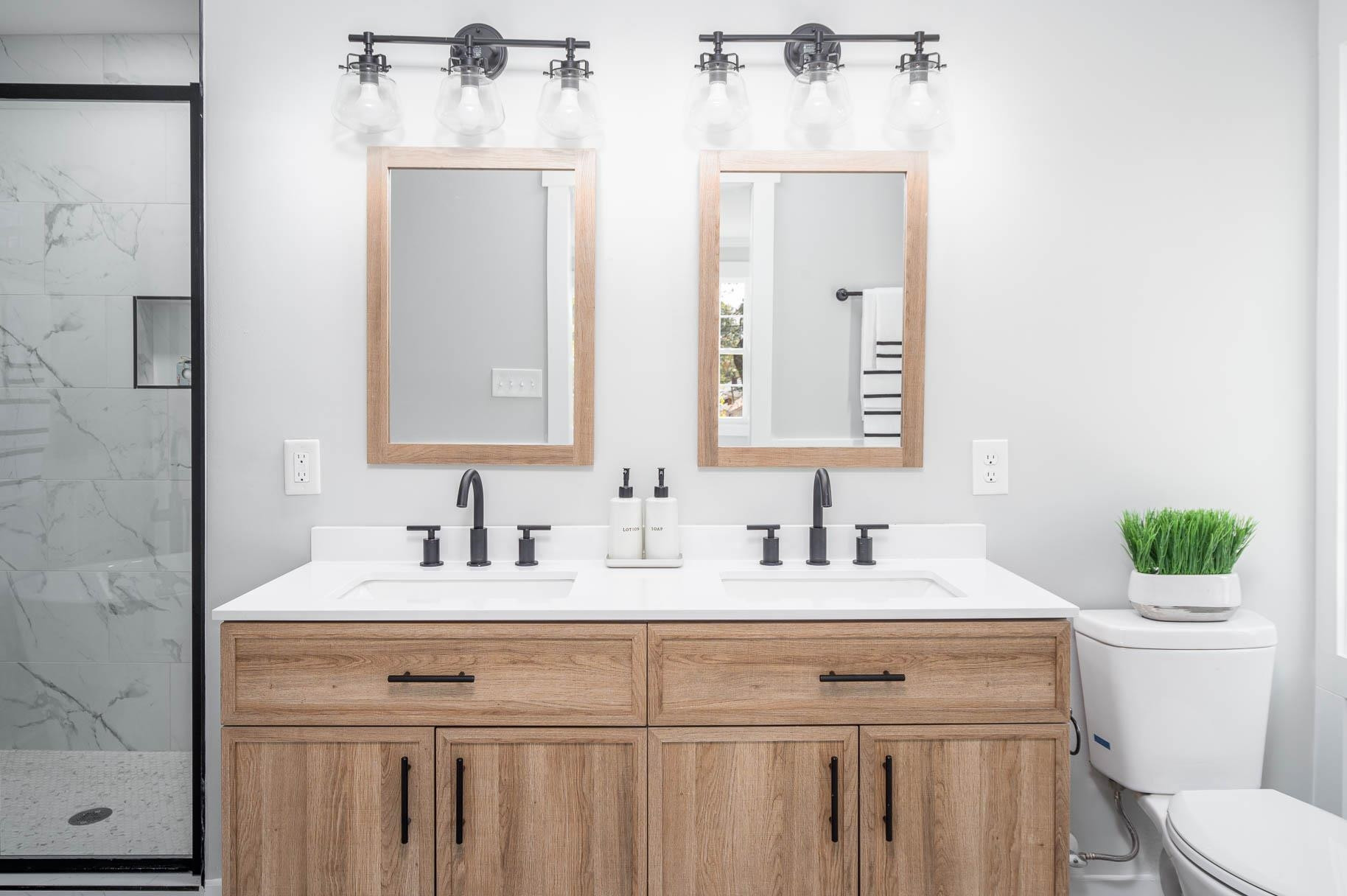 2108 Ramseur Street Raleigh, NC 27610 - Photo 20 of 26 a bathroom with a sink and a mirror