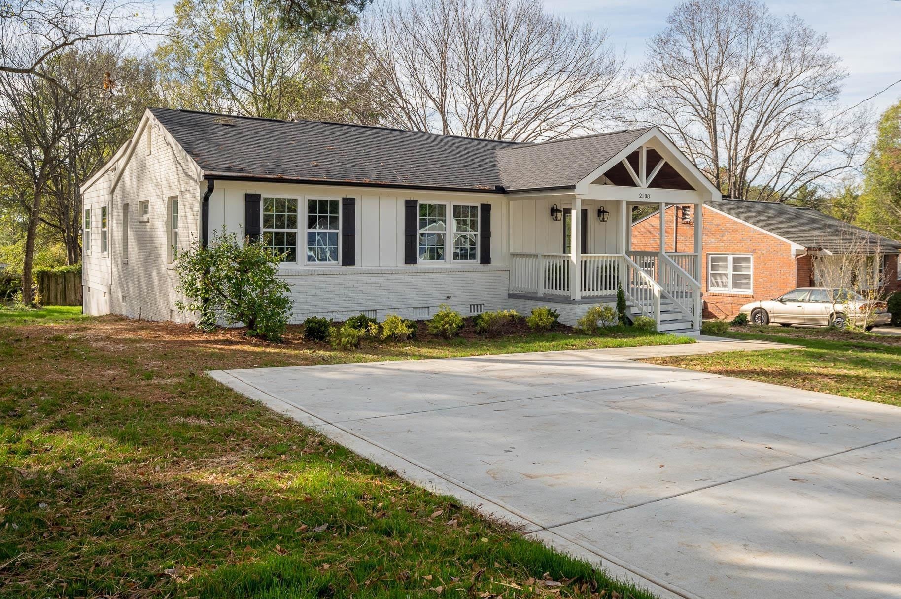 2108 Ramseur Street Raleigh, NC 27610 - Photo 2 of 26 a view of a yard in front of a house