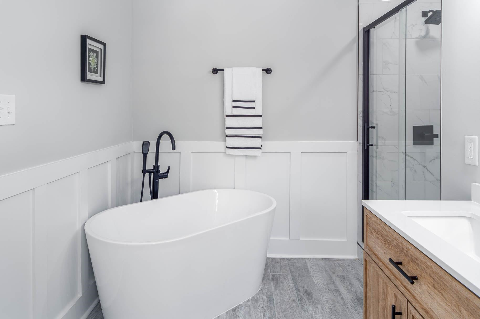 2108 Ramseur Street Raleigh, NC 27610 - Photo 21 of 26 a white bath tub sitting in a bathroom