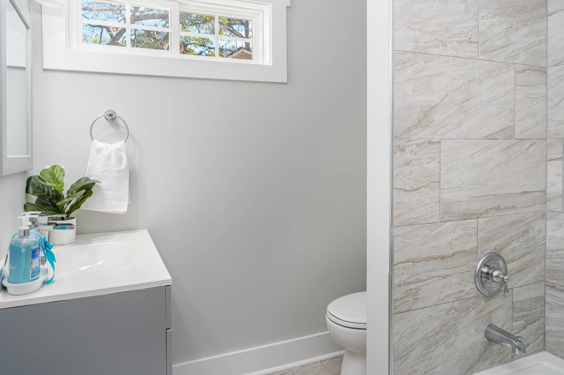 2108 Ramseur Street Raleigh, NC 27610 - Photo 24 of 26 a bathroom with a toilet a sink and a shower